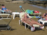 6330987-mature-blonde-lady-with-big-tits-topless-at-the-beach.jpg