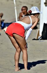 Alessandra-Ambrosio-shows-off-her-fit-body-in-a-white-swimsuit-while-playing-beach-volleyball-...jpg