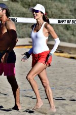 Alessandra-Ambrosio-shows-off-her-fit-body-in-a-white-swimsuit-while-playing-beach-volleyball-...jpg