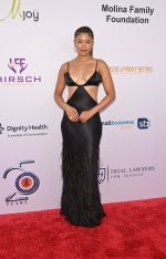 storm-reid-cleavage-braless-curves-red-carpet-008.jpg