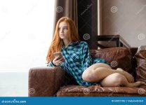 attractive-lady-sitting-sofa-listening-to-music-seductive-young-long-red-hair-plaid-shirt-6305...jpg
