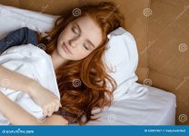 redhead-woman-sleeping-bed-portrait-young-home-63051967.jpg