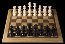 1280px-Opening_chess_position_from_black_side.jpg