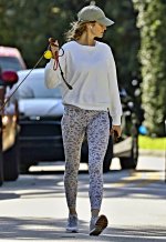 Gisele-Bundchen-sports-a-white-sweatshirt-and-animal-print-leggings-while-enjoying-a-stroll-wi...jpg