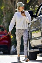 Gisele-Bundchen-sports-a-white-sweatshirt-and-animal-print-leggings-while-enjoying-a-stroll-wi...jpg