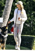 Gisele-Bundchen-sports-a-white-sweatshirt-and-animal-print-leggings-while-enjoying-a-stroll-wi...jpg