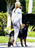 Gisele-Bundchen-sports-a-white-sweatshirt-and-animal-print-leggings-while-enjoying-a-stroll-wi...jpg