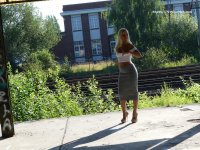 6237706-beautiful-blonde-woman-in-white-shirt-grey-skirt-and-high-heels-without-underwear.jpg