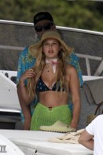 millie-bobby-brown-stuns-in-a-bikini-top-while-she-enjoys-a-boat-ride-with-boyfriend-jake-bong...jpg