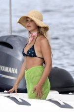 millie-bobby-brown-stuns-in-a-bikini-top-while-she-enjoys-a-boat-ride-with-boyfriend-jake-bong...jpg