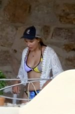 millie-bobby-brown-soaks-up-the-sun-in-a-colorful-bikini-before-grabbing-beachside-lunch-with-...jpg