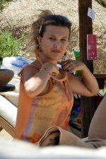 millie-bobby-brown-seen-wearing-an-orange-bikini-while-relaxing-by-the-beach-with-boyfriend-ja...jpg