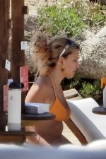 millie-bobby-brown-seen-wearing-an-orange-bikini-while-relaxing-by-the-beach-with-boyfriend-ja...jpg